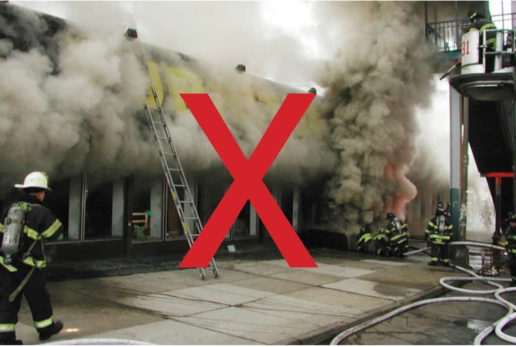 If fire vents from the show window, the member on the portable ladder could be exposed to heat and/or flame.